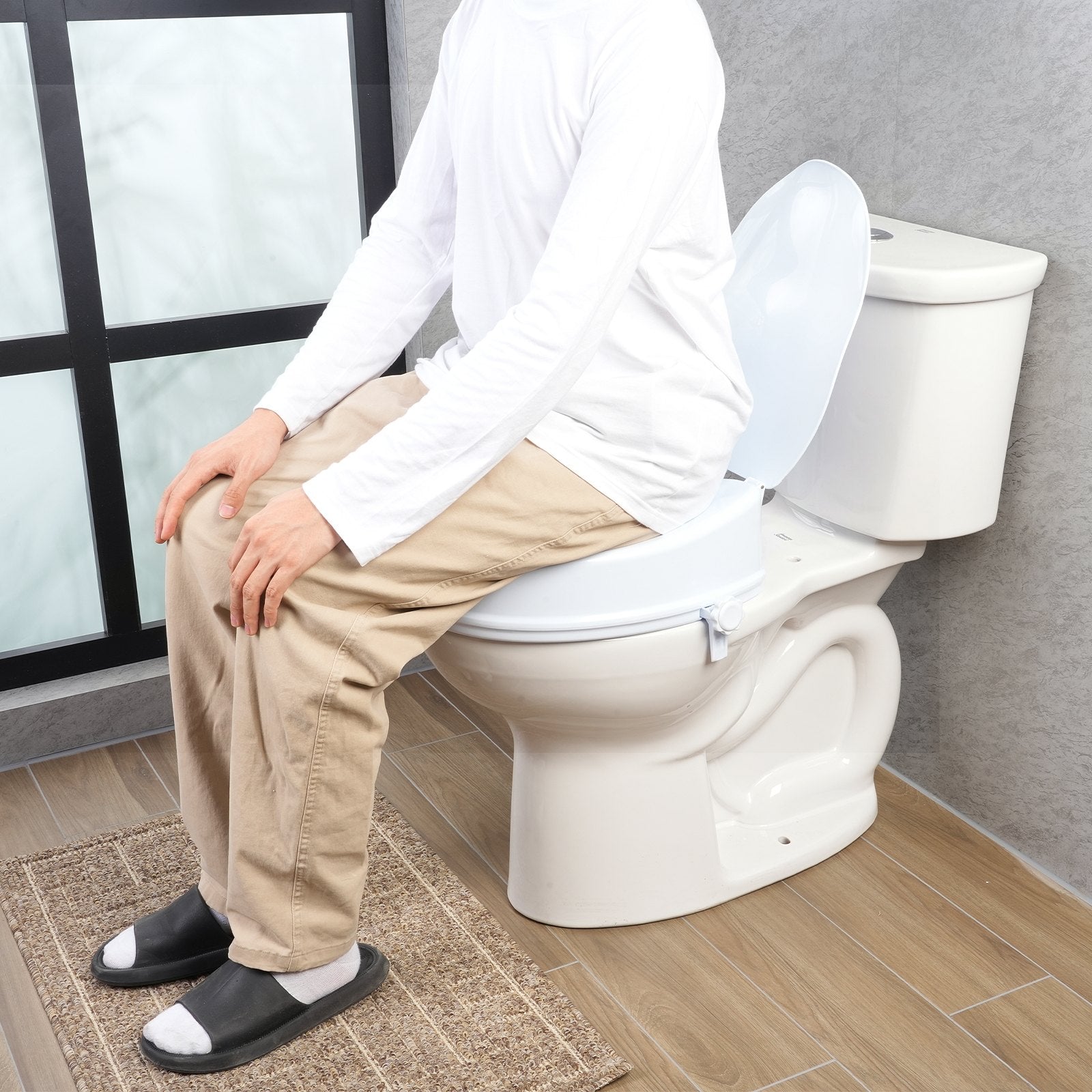 Raised Toilet Seat 100mm Height 136kg Capacity Screw Rod Locking Universal Riser